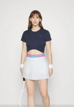 Fila Skort Finja - Jupe Plissée - White -Magasin De Mode Et De Sport 0f4711a7c28b4ccc87d2129f598b4d84 scaled