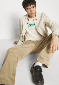 Fila Battweiler Tee Unisex - T-Shirt Imprimé - White -Magasin De Mode Et De Sport 43783f0e12c84cbf99abe5348d98580e scaled