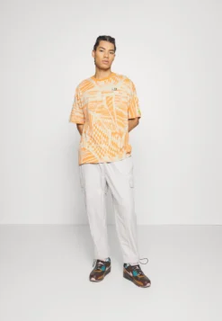 Fila Oversized Tee Unisex - T-Shirt Imprimé - Orange -Magasin De Mode Et De Sport cf6a9f8cbaa4419f996eece905e11402 scaled